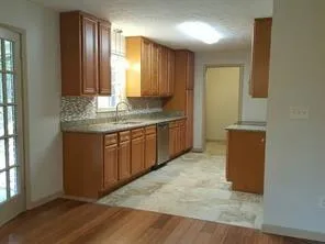 a view of a kitchen with a sink and a dishwasher