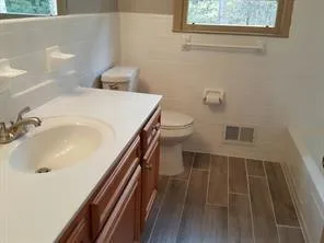 a bathroom with a sink and a toilet