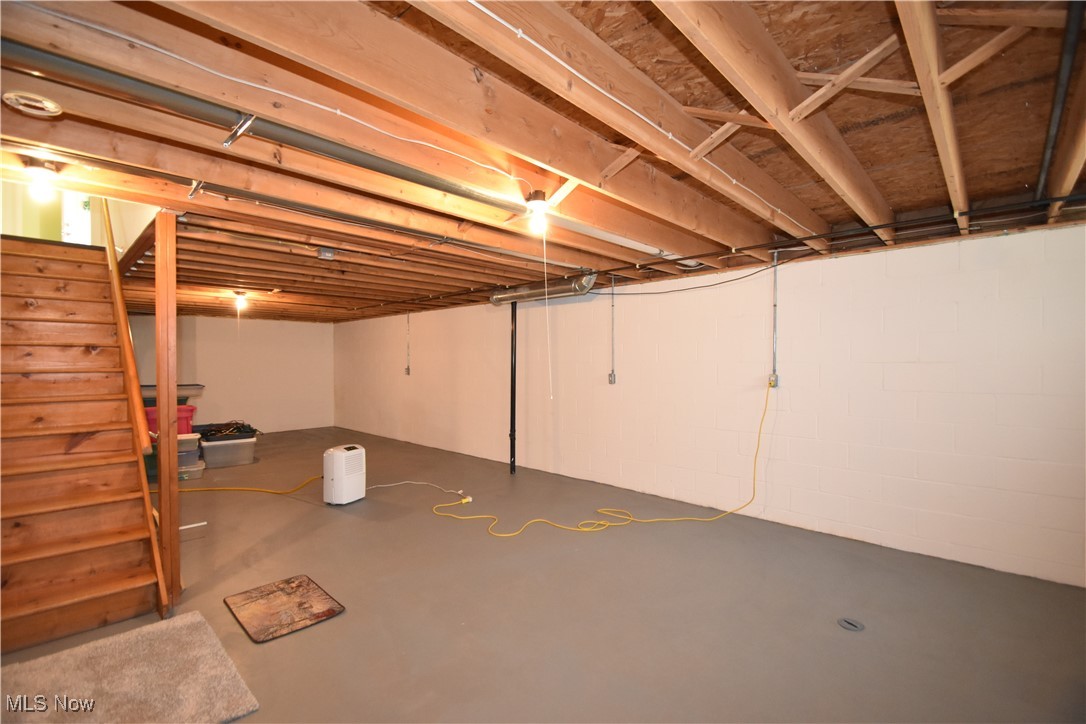603 South Raccoon Road, Unit 49 Youngstown, OH 44515 - Photo 27 of 27 Unfinished basement with stairway