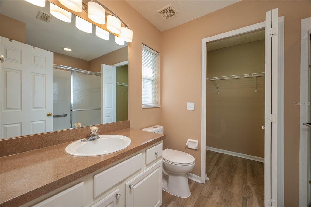 126 Piano Lane Davenport, FL 33896 - Photo 12 of 24 a bathroom with a sink toilet and shower