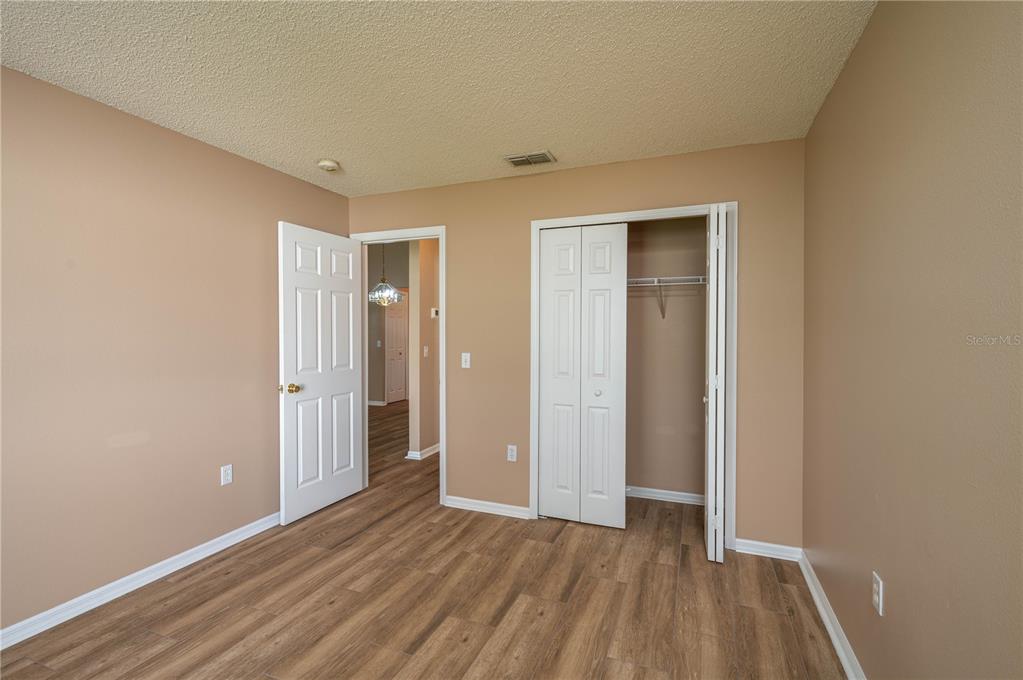 126 Piano Lane Davenport, FL 33896 - Photo 18 of 24 wooden floor in an empty room