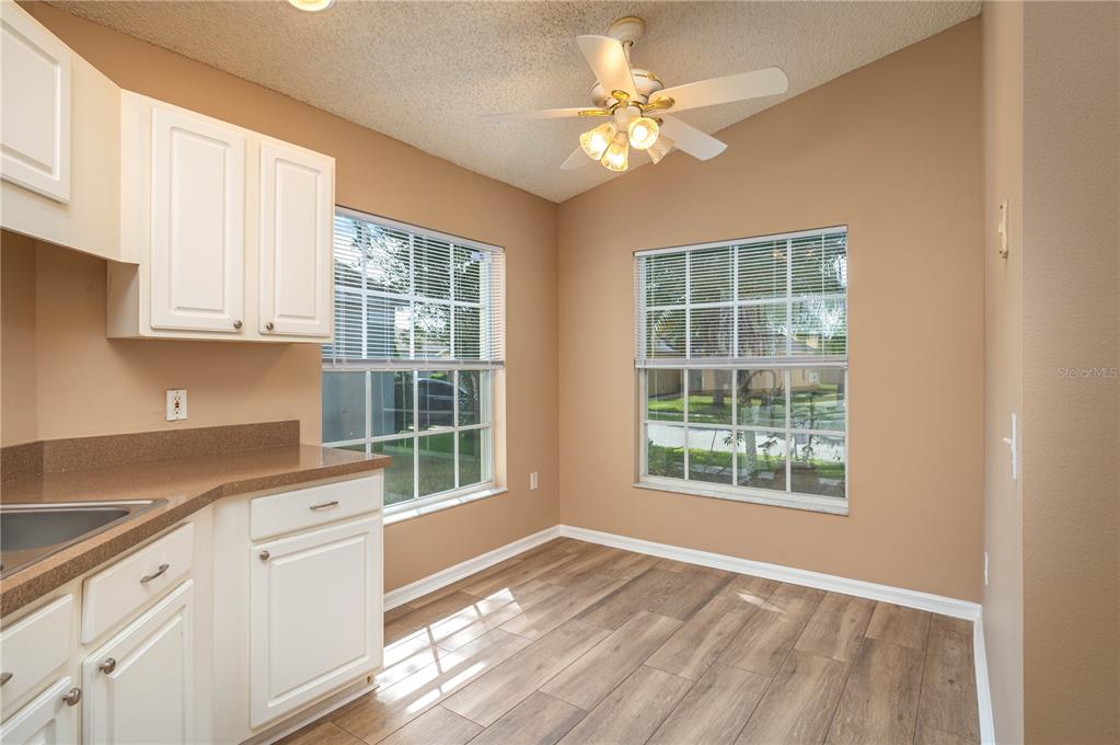 126 Piano Lane Davenport, FL 33896 - Photo 7 of 24 a view of a kitchen with marble kitchen and a sink