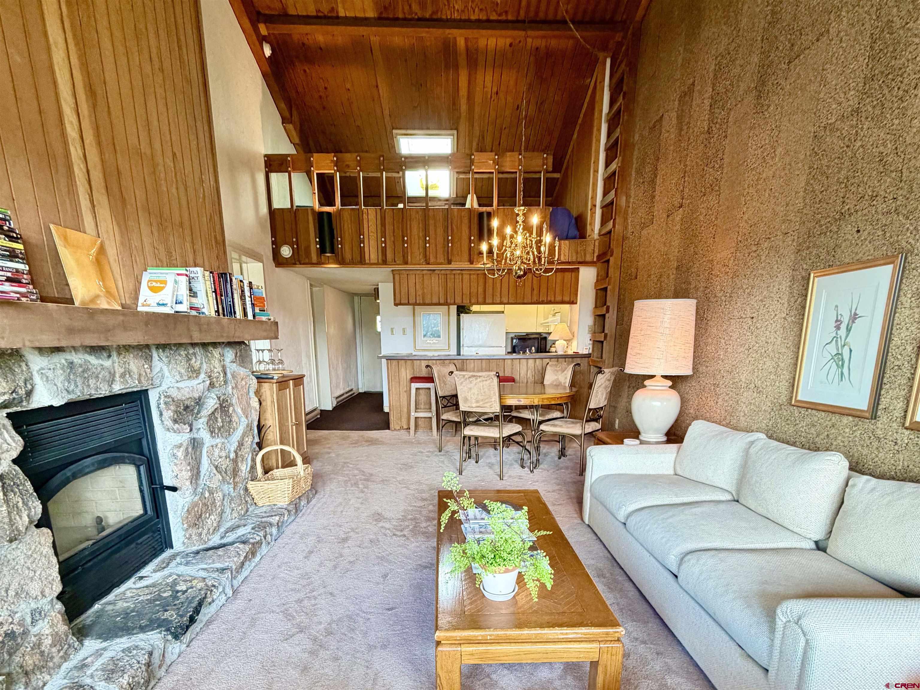 51 Whetstone Road, Unit 2306 Crested Butte, CO 81225 - Photo 12 of 44 a living room with furniture and a fireplace