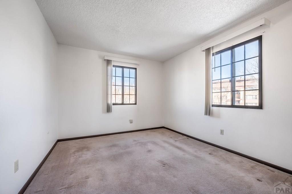 1901 Mohawk Road Pueblo, CO 81001 - Photo 11 of 30 an empty room with windows