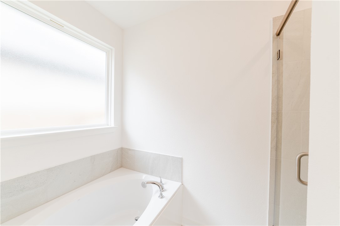 1901 Sebright Drive Bryan, TX 77807 - Photo 12 of 13 a white bath tub sitting next to a window