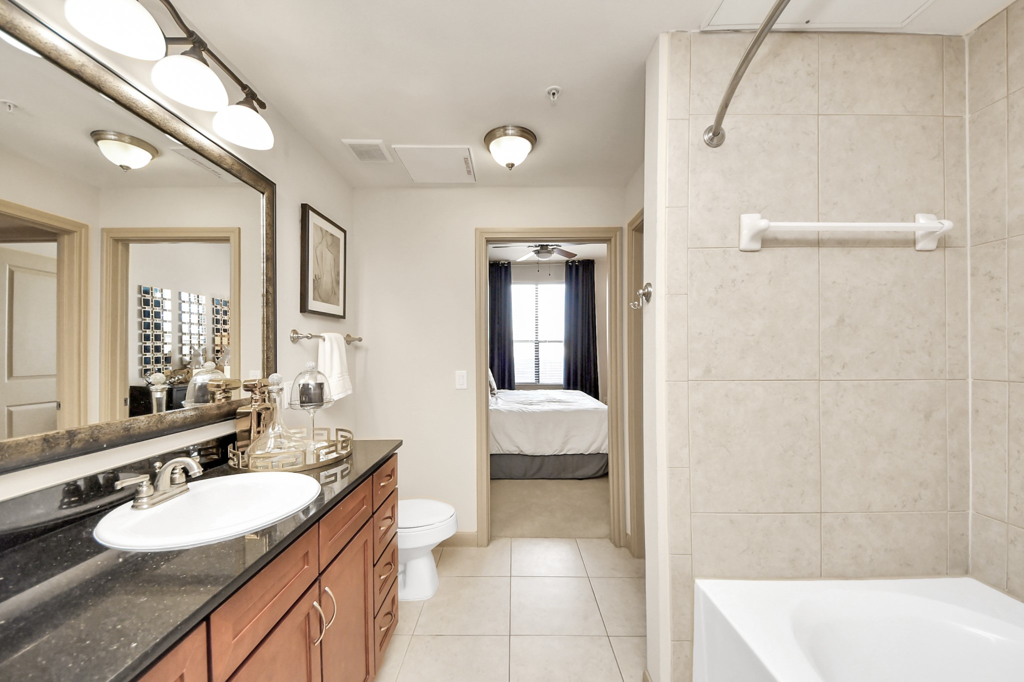 6363 San Felipe Street, Unit 235 Houston, TX 77057 - Photo 21 of 43 a spacious bathroom with a double vanity sink a mirror and a bathtub