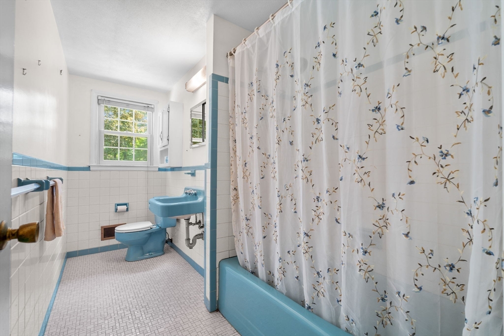 348 Belknap Road Framingham, MA 01701 - Photo 21 of 35 a bathroom with a toilet a sink and a window