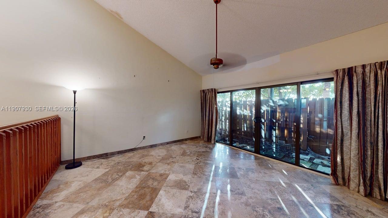 4222 Southwest 87th Terrace Davie, FL 33328 - Photo 12 of 85 Wide perspective showcasing the open floor plan and connection to the scenic backyard oasis.