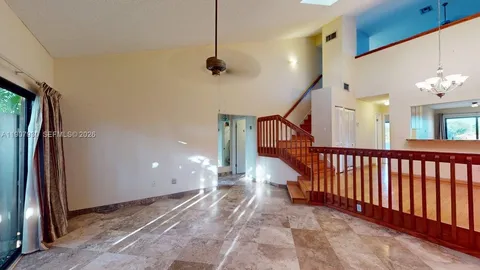 a kitchen with stainless steel appliances granite countertop a refrigerator a sink and a stove