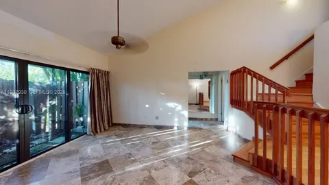 a kitchen with a stove a sink and a microwave