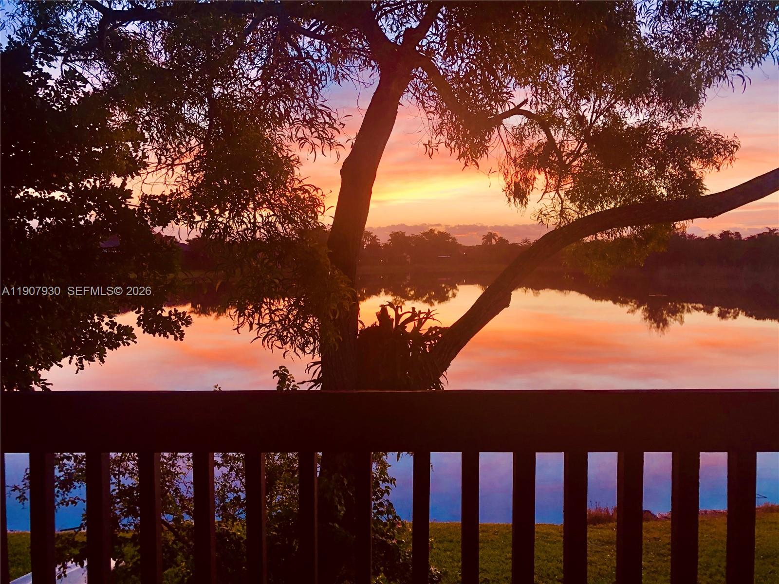 4222 Southwest 87th Terrace Davie, FL 33328 - Photo 2 of 85 Unwind each evening with breathtaking sunset views over the tranquil lake, your private slice of South Florida paradise.