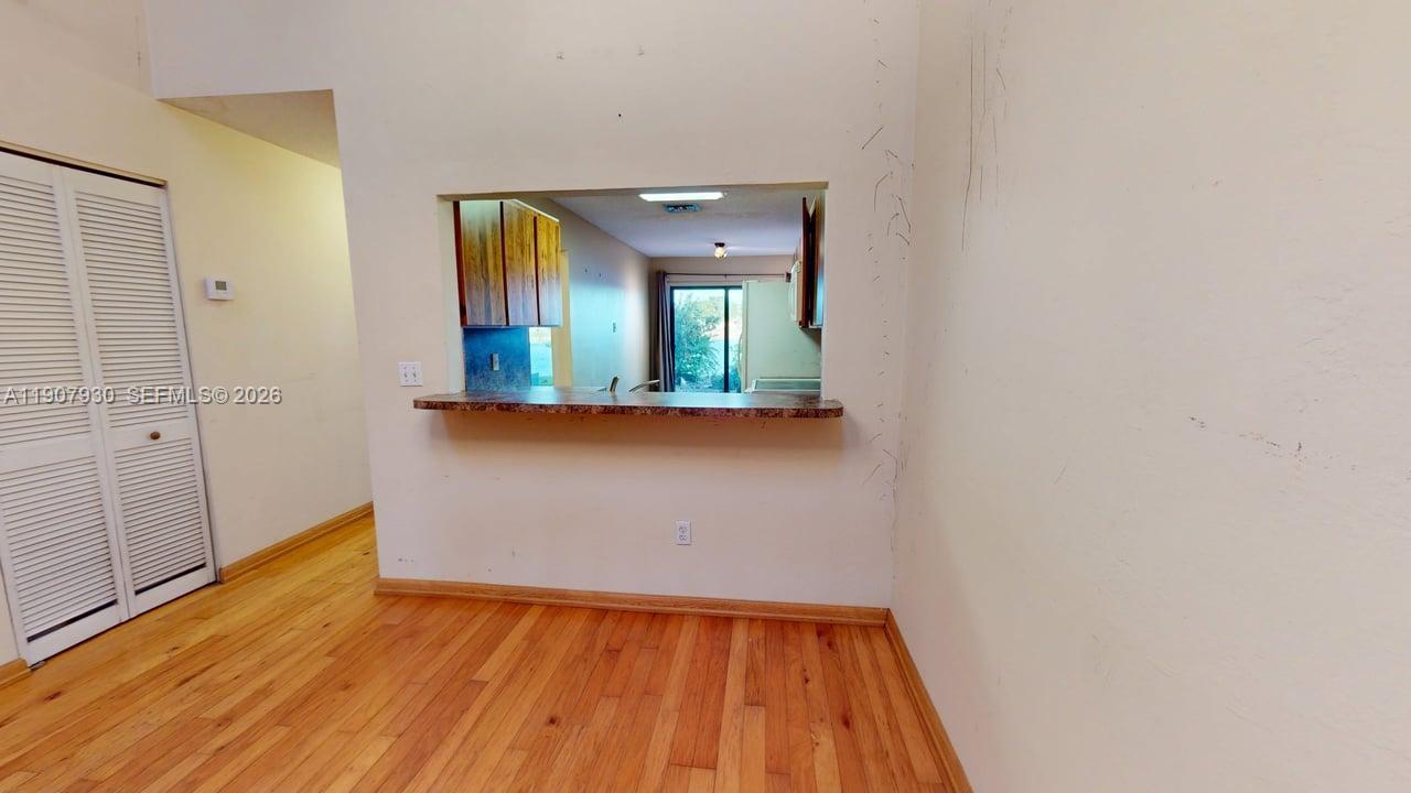 4222 Southwest 87th Terrace Davie, FL 33328 - Photo 21 of 85 a view of a room with wooden floor and mirror