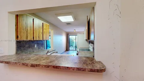a view of a glass door and a porch