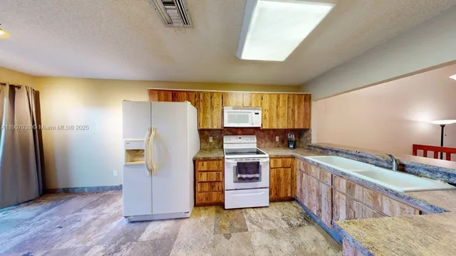 a view of a glass door and a yard from a balcony