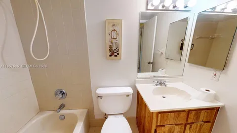 a view of a livingroom with a ceiling fan and window