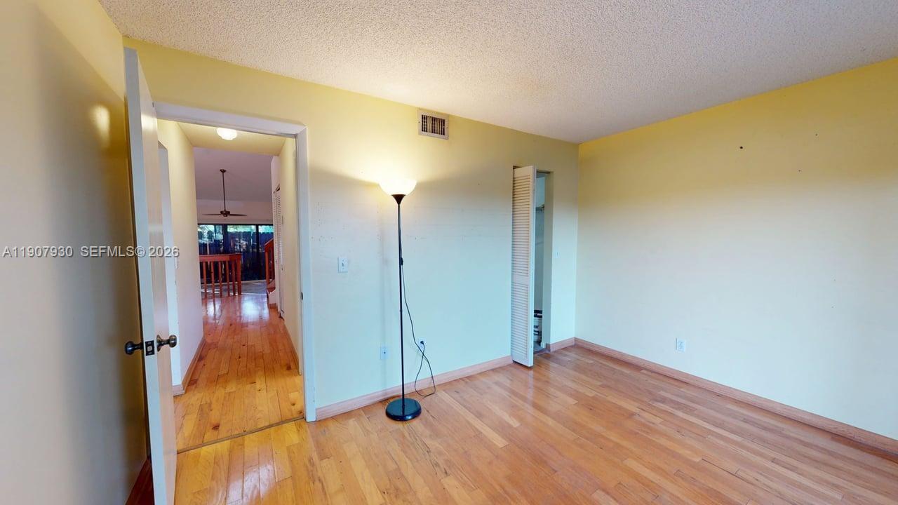 4222 Southwest 87th Terrace Davie, FL 33328 - Photo 42 of 85 Bright and spacious bedrooms featuring large windows, natural light, and serene views that create a calm, inviting retreat.