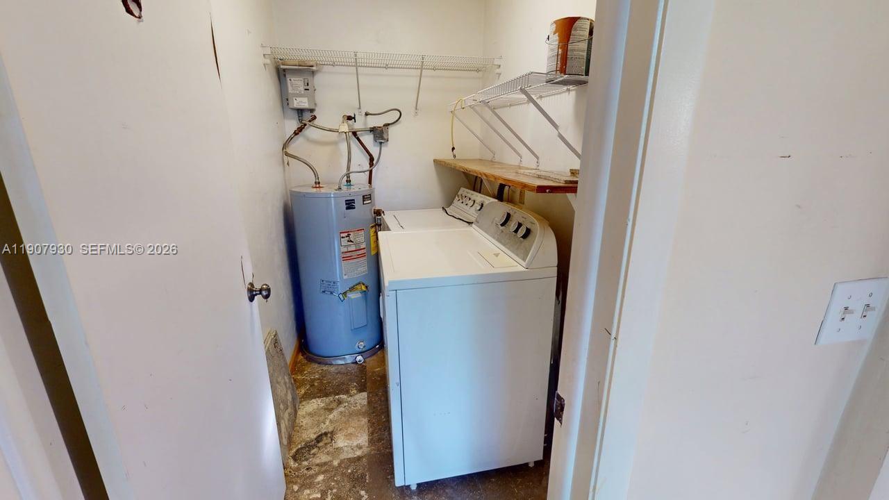 4222 Southwest 87th Terrace Davie, FL 33328 - Photo 6 of 85 Convenient in-unit laundry area offering everyday functionality and storage potential.