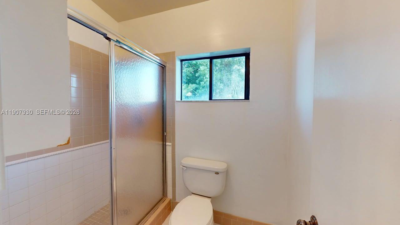 4222 Southwest 87th Terrace Davie, FL 33328 - Photo 62 of 85 a bathroom with a toilet and a shower