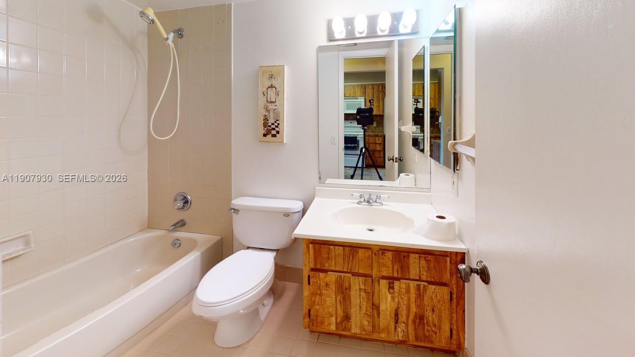4222 Southwest 87th Terrace Davie, FL 33328 - Photo 69 of 85 a bathroom with a sink vanity mirror and toilet