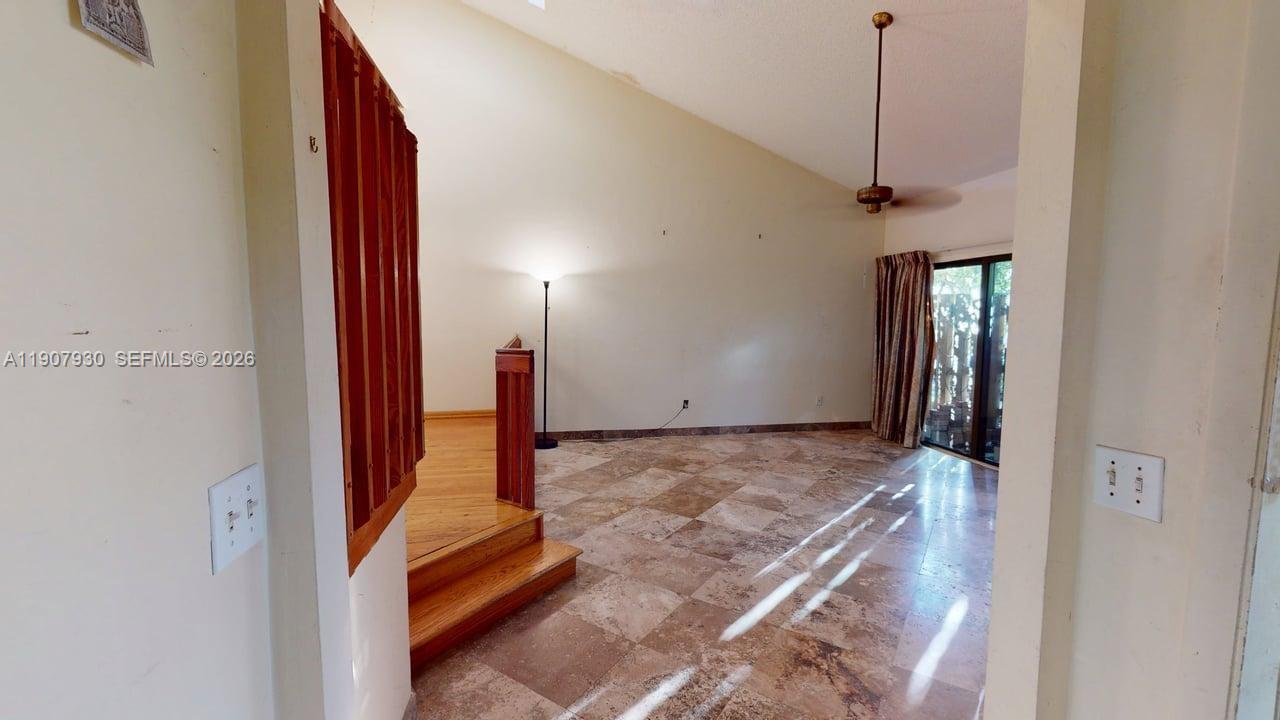 4222 Southwest 87th Terrace Davie, FL 33328 - Photo 8 of 85 Spacious open-concept living area with soaring ceilings and abundant natural light ideal for entertaining or quiet evenings in.