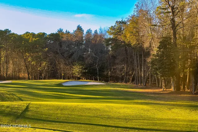 a view of a swimming pool with an outdoor space and seating area