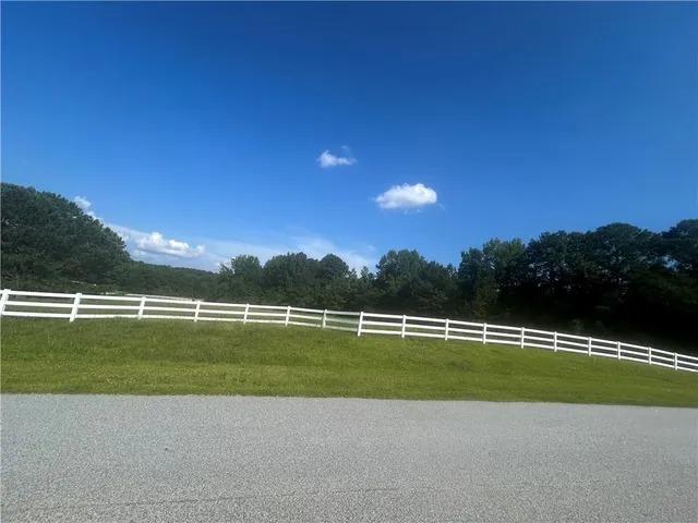 a view of a golf course with a lake