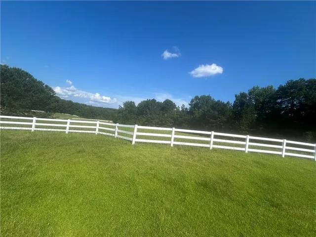 a view of a golf course with a lake