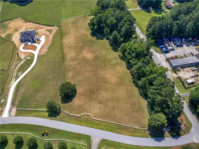 an aerial view of residential house with outdoor space and swimming pool