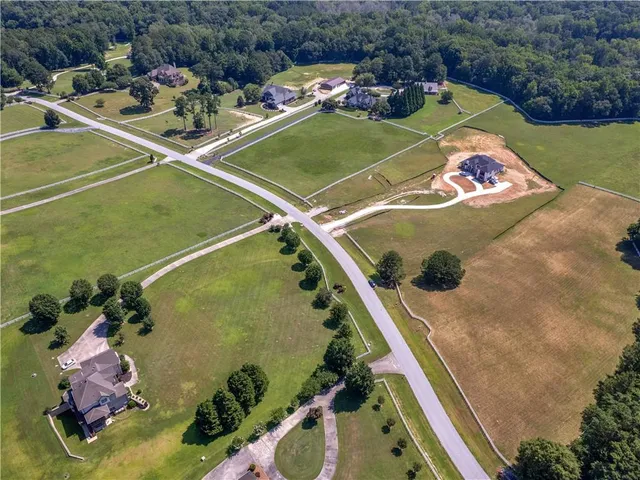 an aerial view of a pool patio swimming pool and outdoor seating
