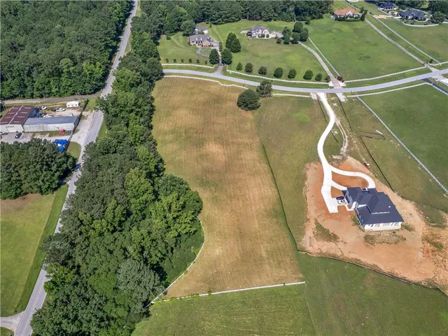 a aerial view of a house with a yard