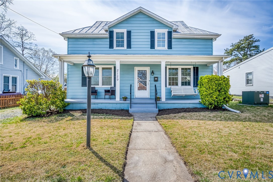 2129 Ginter Street Richmond, VA 23228 - Photo 1 of 38 a view of a house with sitting area and garden