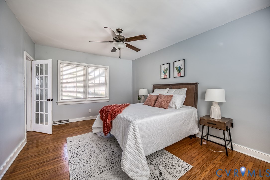 2129 Ginter Street Richmond, VA 23228 - Photo 17 of 38 a spacious bedroom with a bed and a table