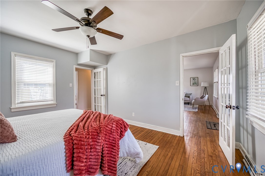 2129 Ginter Street Richmond, VA 23228 - Photo 19 of 38 a bedroom with a bed and a wooden floor