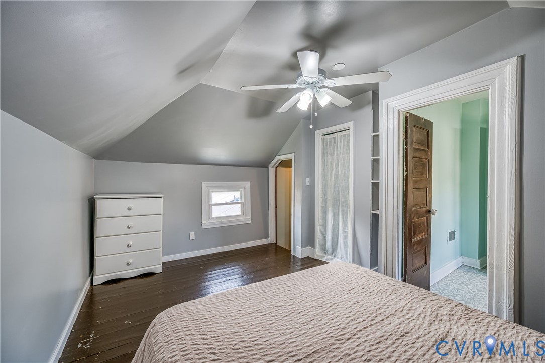 2129 Ginter Street Richmond, VA 23228 - Photo 22 of 38 a bedroom with a bed and a chandelier