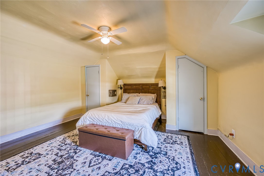 2129 Ginter Street Richmond, VA 23228 - Photo 24 of 38 a bedroom with a bed and wooden floor