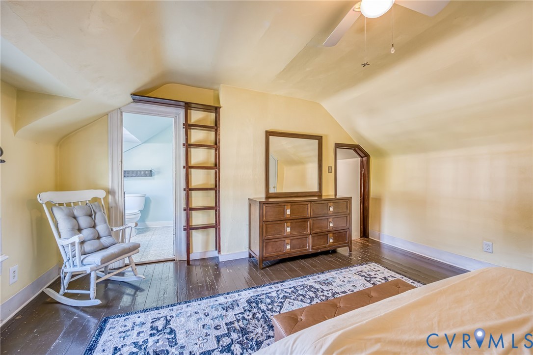 2129 Ginter Street Richmond, VA 23228 - Photo 25 of 38 a bedroom with a bed and wooden floor