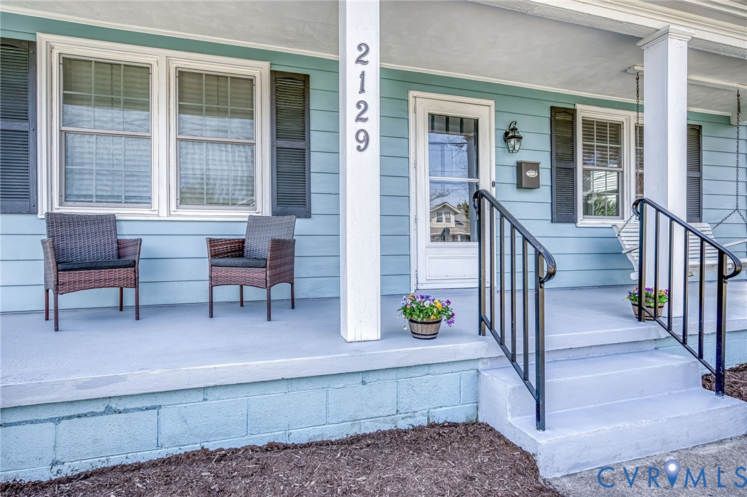 2129 Ginter Street Richmond, VA 23228 - Photo 4 of 38 a view of porch with a bench and chairs