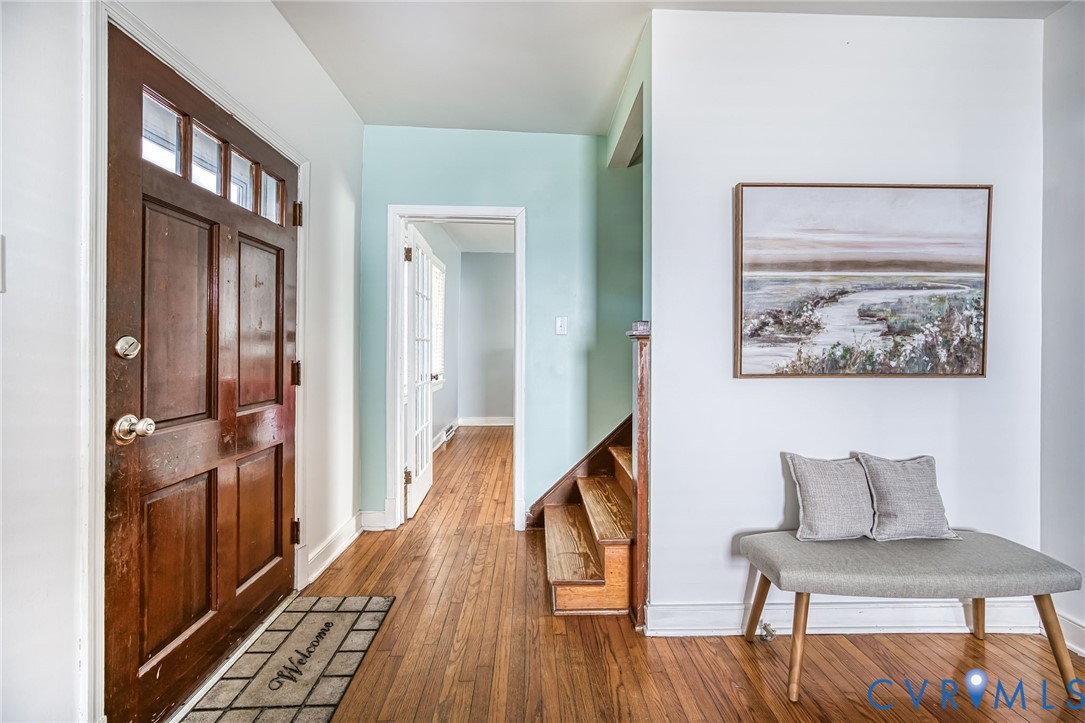 2129 Ginter Street Richmond, VA 23228 - Photo 5 of 38 a view of a hallway with furniture and wooden floor