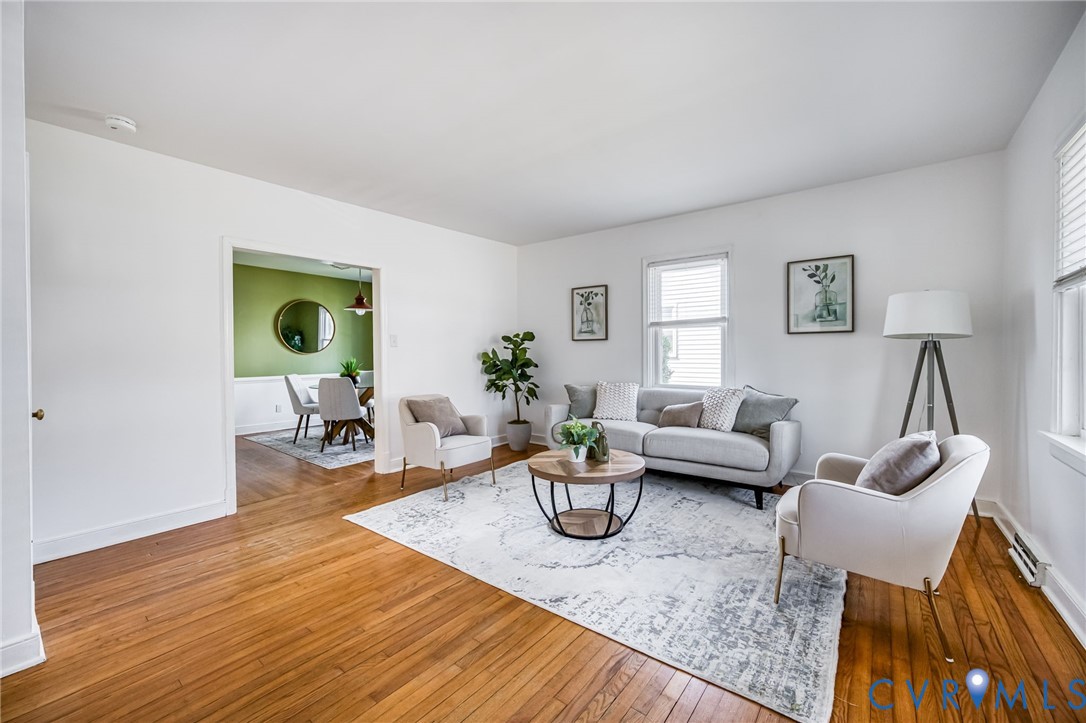2129 Ginter Street Richmond, VA 23228 - Photo 7 of 38 a living room with furniture and a wooden floor