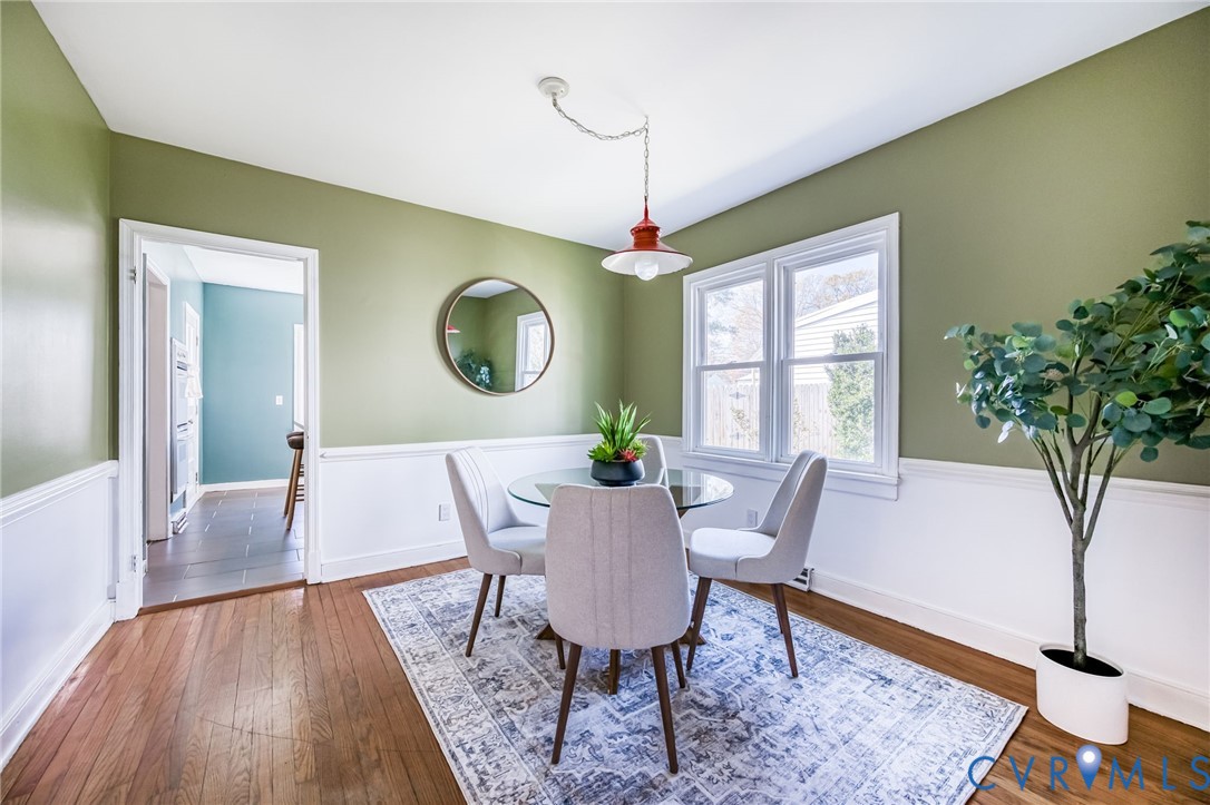 2129 Ginter Street Richmond, VA 23228 - Photo 9 of 38 a view of a dining room with furniture window and wooden floor