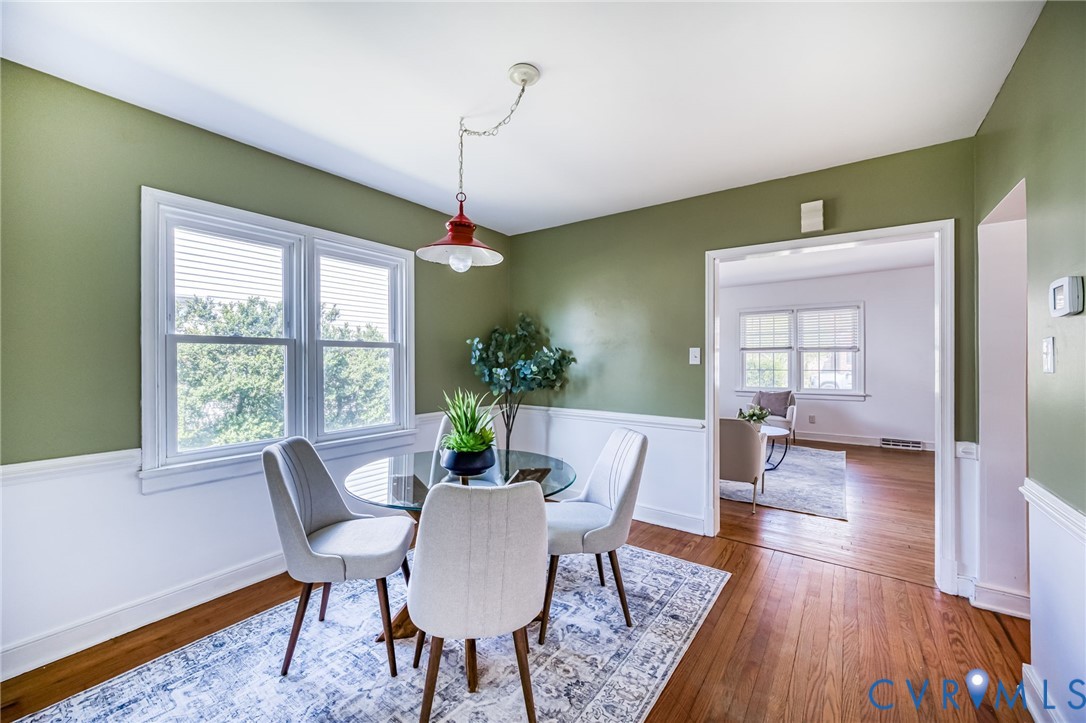 2129 Ginter Street Richmond, VA 23228 - Photo 10 of 38 a view of a dining room with furniture window and wooden floor