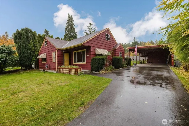 a front view of a house with garden