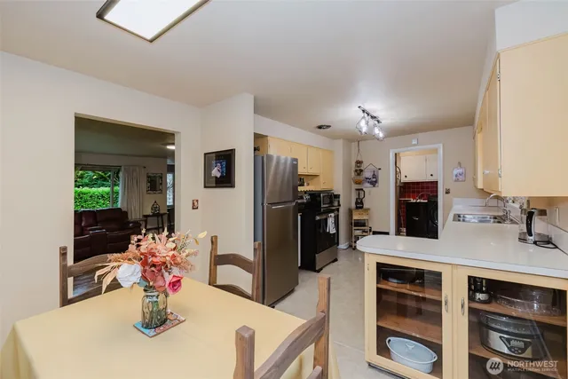 a kitchen with stainless steel appliances a refrigerator and a stove