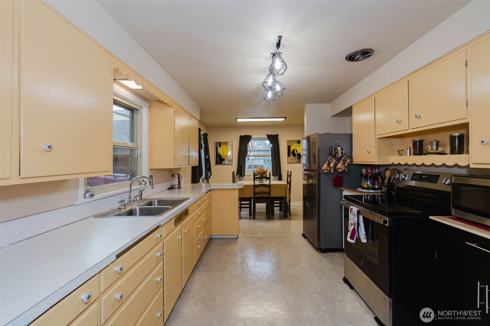 3126 Rocky Point Road Northwest Bremerton, WA 98312 - Photo 14 of 40 a large kitchen with stainless steel appliances