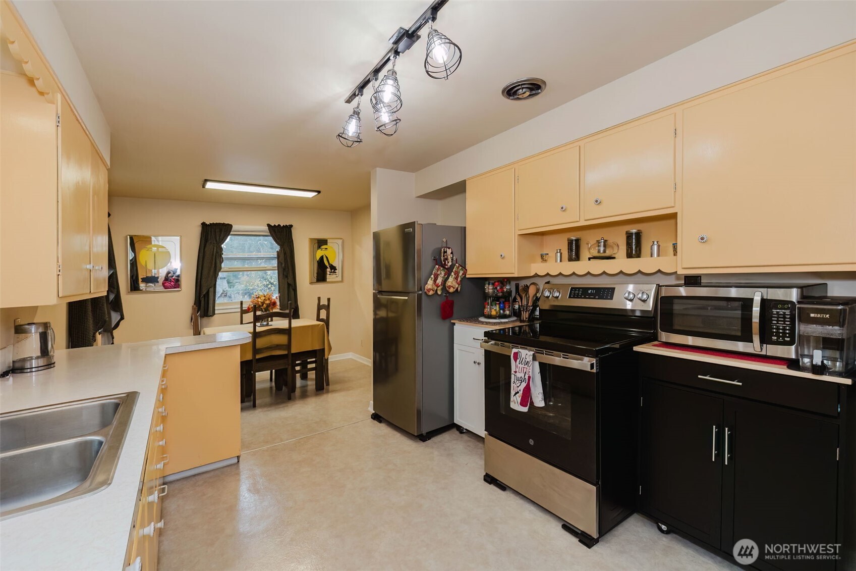 3126 Rocky Point Road Northwest Bremerton, WA 98312 - Photo 15 of 40 a kitchen with a sink appliances and cabinets