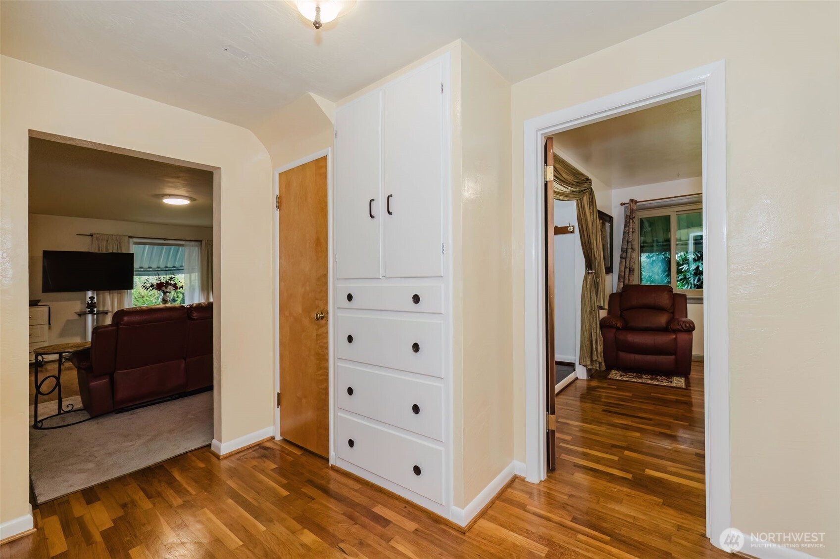 3126 Rocky Point Road Northwest Bremerton, WA 98312 - Photo 16 of 40 a view of a hallway with closet and a fireplace