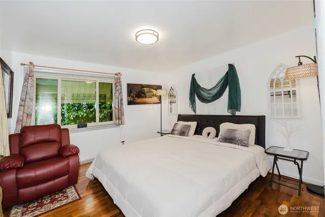 a bedroom with bed and a window