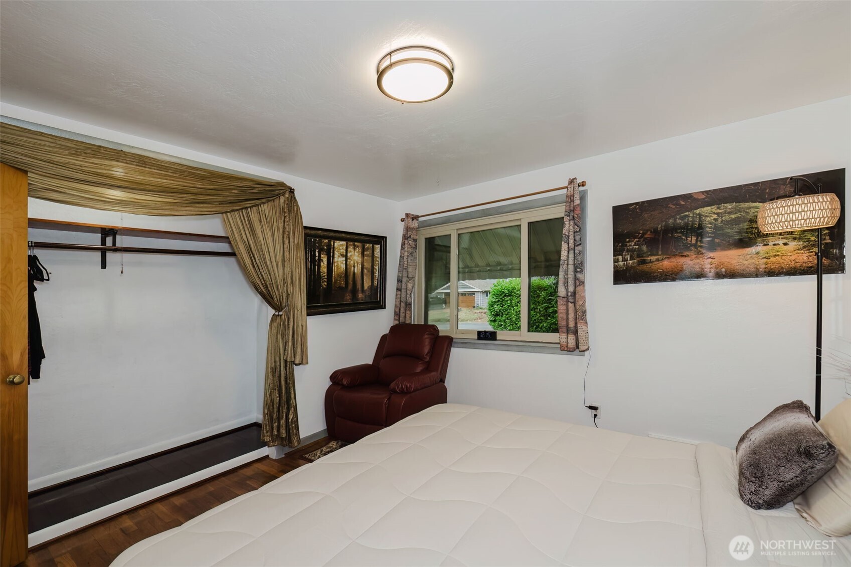 3126 Rocky Point Road Northwest Bremerton, WA 98312 - Photo 18 of 40 a bedroom with bed and a window