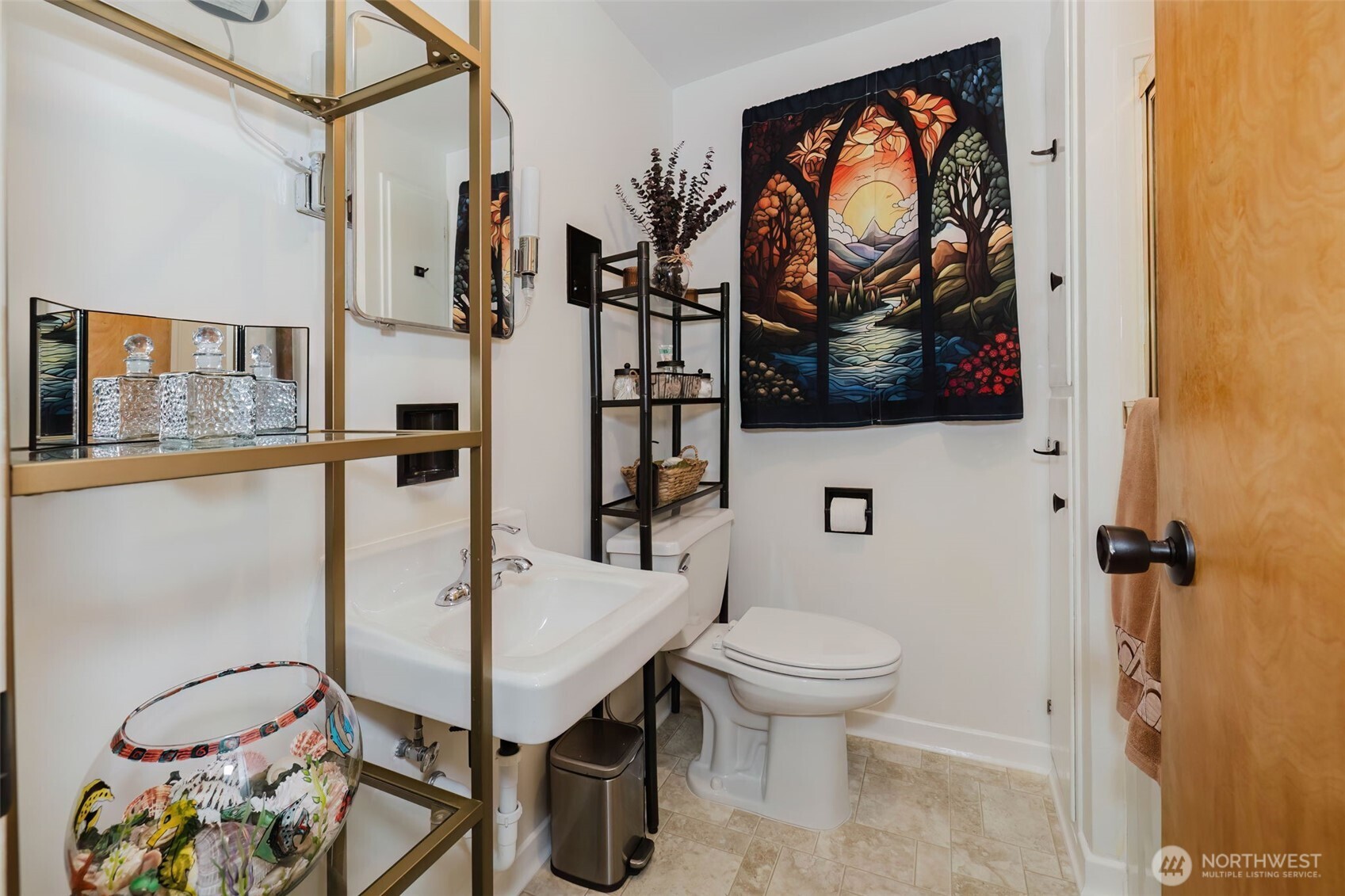 3126 Rocky Point Road Northwest Bremerton, WA 98312 - Photo 20 of 40 a bathroom with a toilet a sink and a mirror