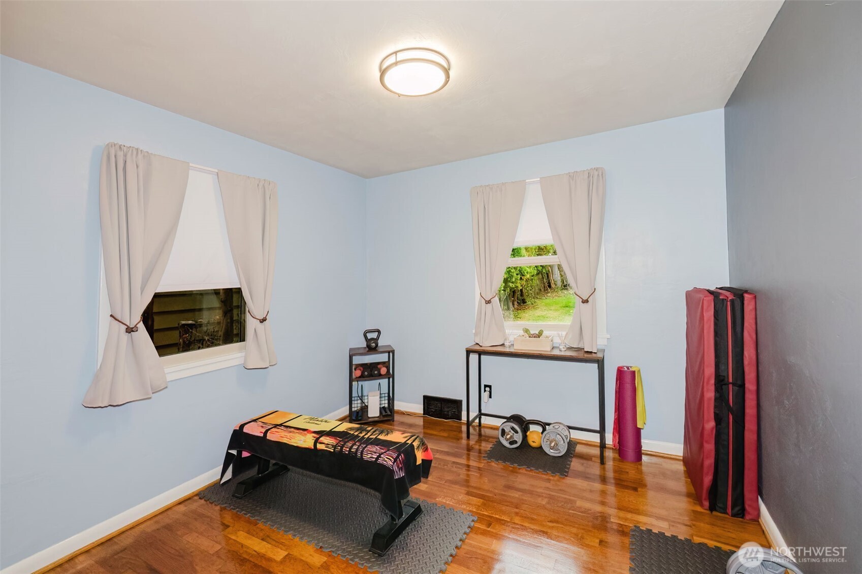 3126 Rocky Point Road Northwest Bremerton, WA 98312 - Photo 22 of 40 a room with furniture and a flat screen tv